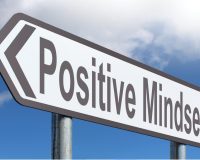 Road sign featuring the words, 'Positive Mindset'